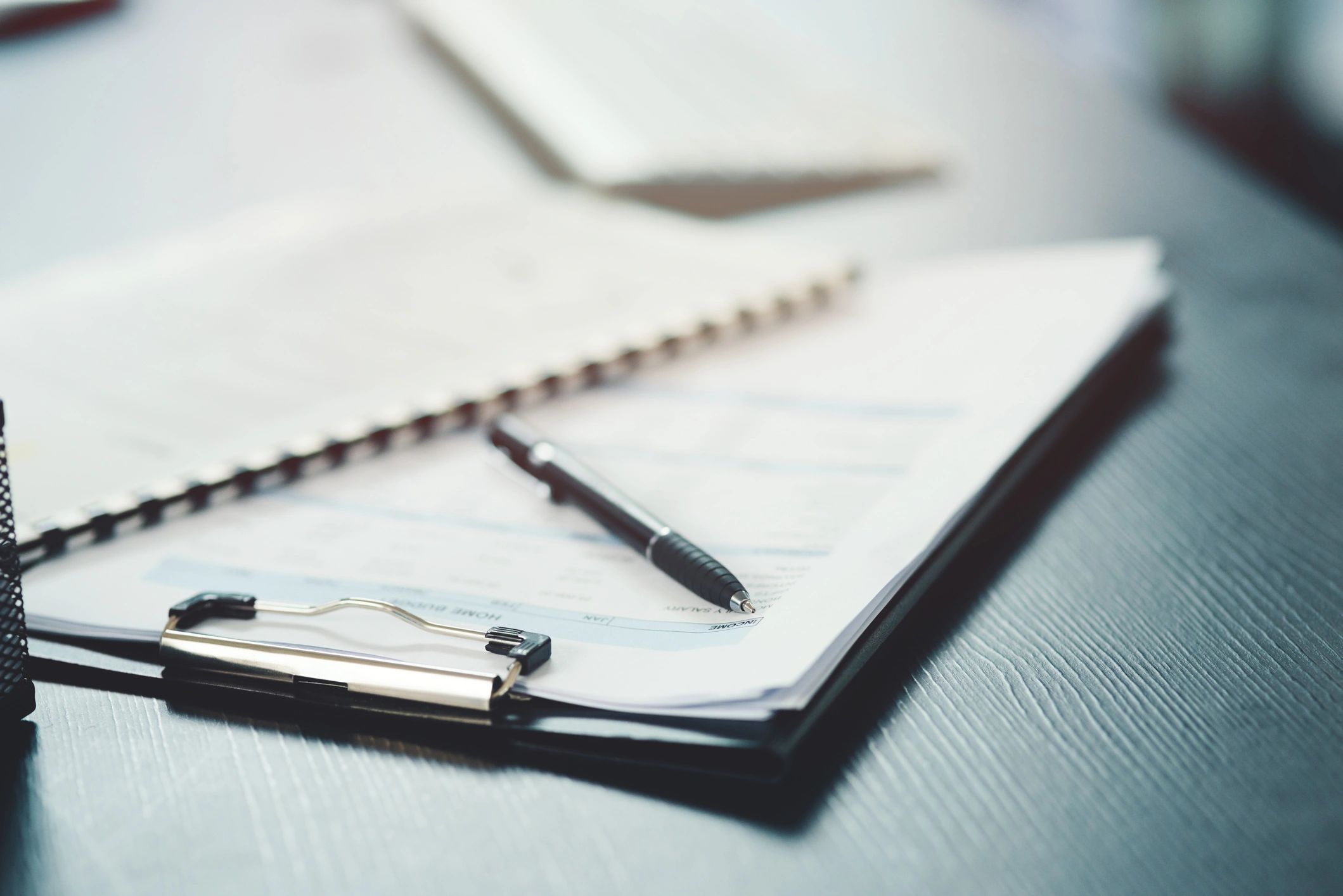 Organized legal documents and notebook on a desk