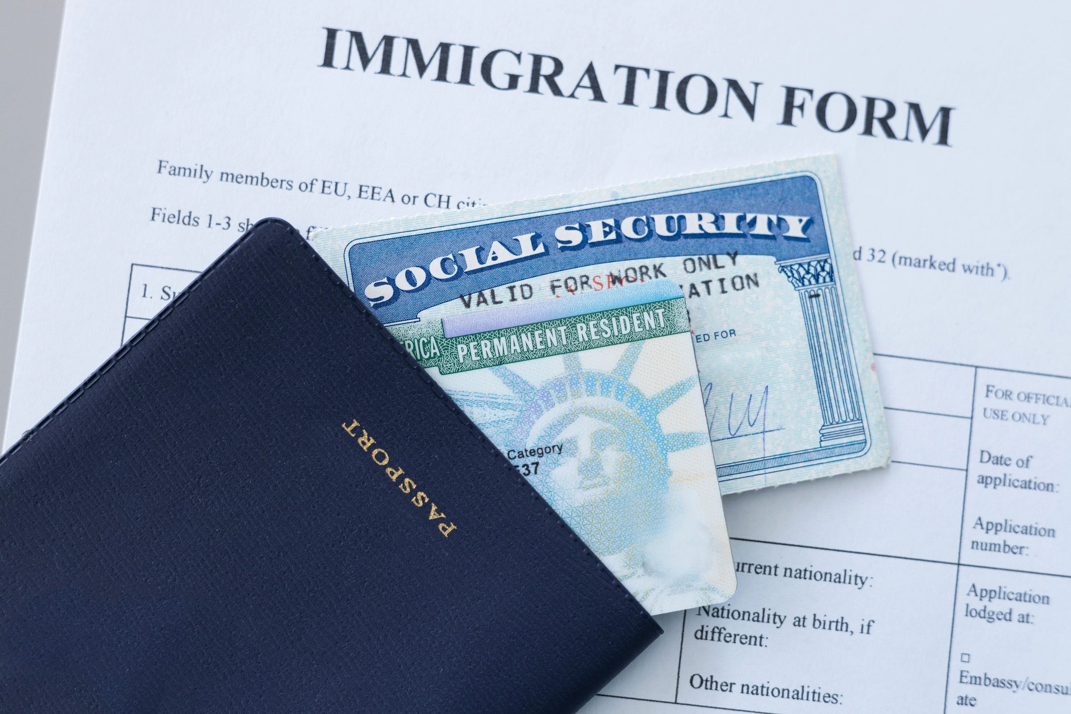 U.S. immigration documents on a form, including a passport and green card